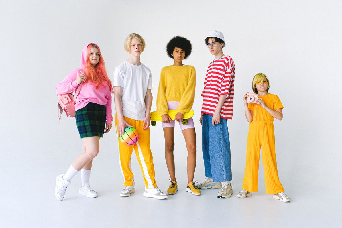 Diverse group of stylish kids and teens in colorful outfits